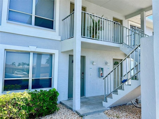 5023 SW 16th Pl Unit 101, Cape Coral, FL 33914 - view of exterior entry with stucco siding