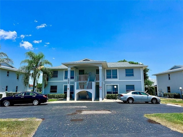 5023 SW 16th Pl Unit 101, Cape Coral, FL 33914 - view of front of home featuring stucco siding and uncovered parking