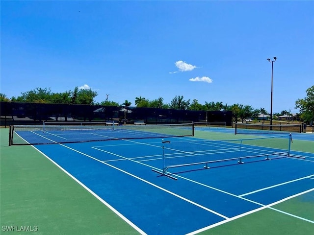 5023 SW 16th Pl Unit 101, Cape Coral, FL 33914 - view of tennis court with community basketball court