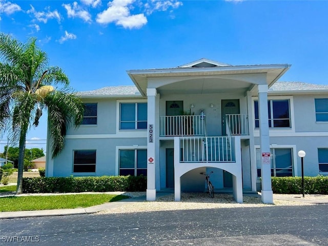 5023 SW 16th Pl Unit 101, Cape Coral, FL 33914 - view of front of home featuring stucco siding and a balcony