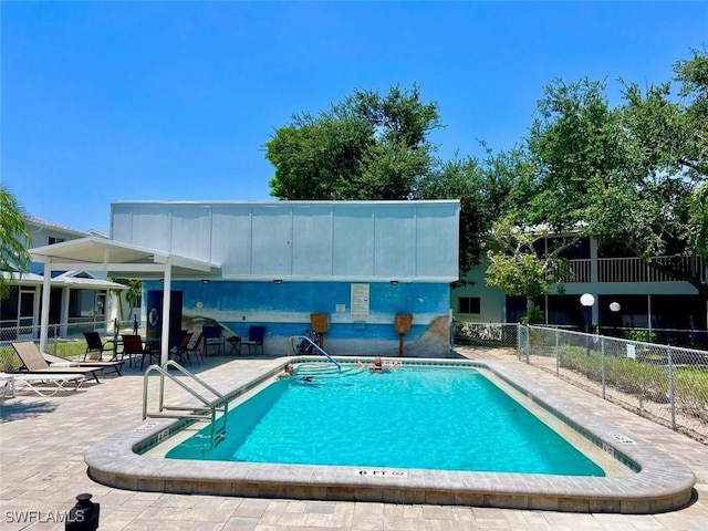 view of swimming pool featuring a patio area