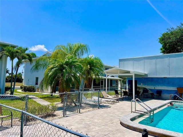 view of swimming pool featuring a patio area