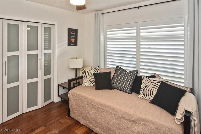 bedroom featuring dark wood-style flooring