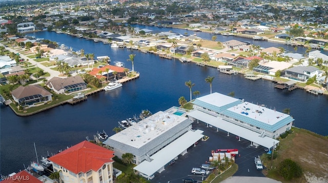 drone / aerial view featuring a water view and a residential view