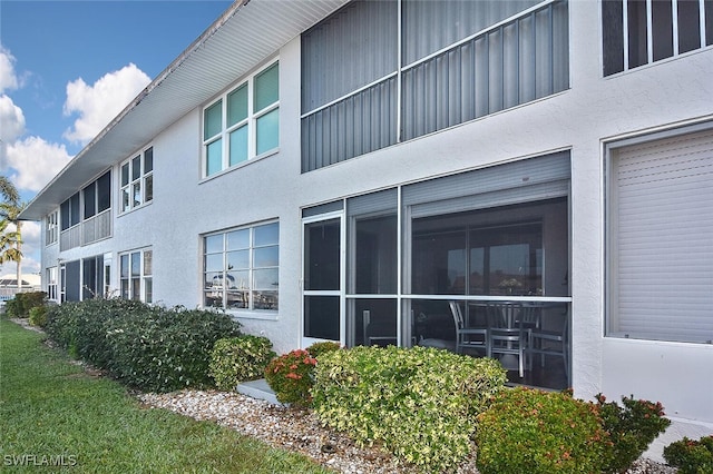 view of property exterior with stucco siding