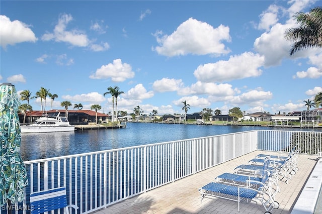 exterior space with a residential view and a water view