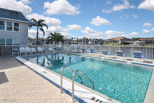 view of swimming pool featuring a patio area