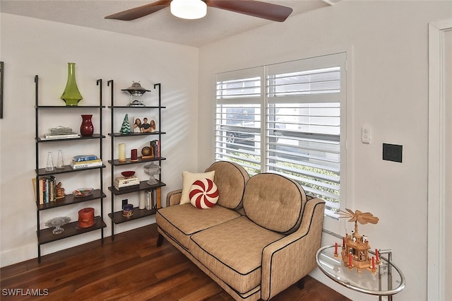living area featuring wood finished floors and ceiling fan