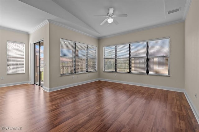 unfurnished room with plenty of natural light, ceiling fan, and wood-type flooring