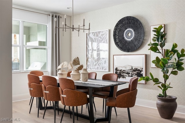 dining area featuring wood finished floors and baseboards