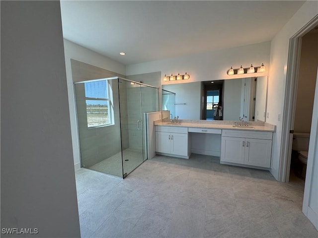 full bath with a shower stall, toilet, and vanity