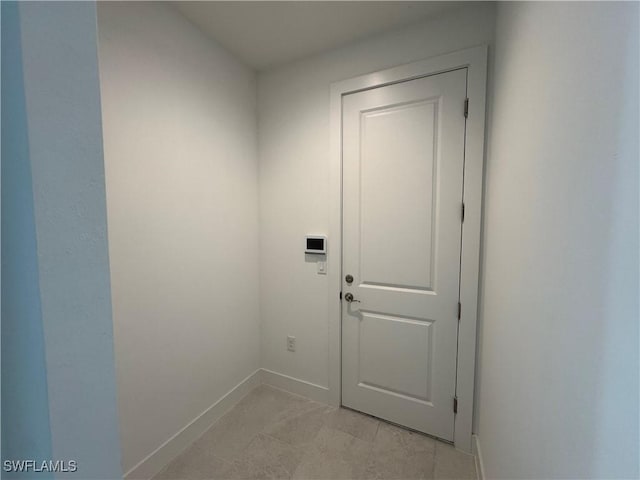 entryway featuring baseboards