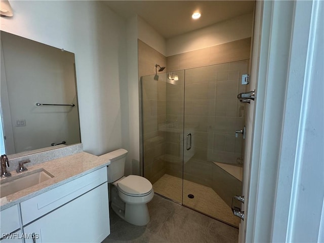 bathroom with toilet, recessed lighting, vanity, a shower stall, and tile patterned floors