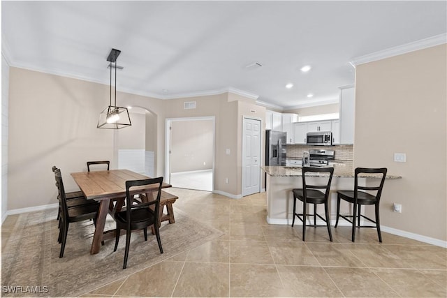 tiled dining space with ornamental molding