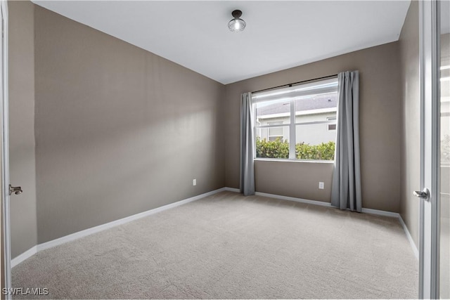 empty room with light colored carpet