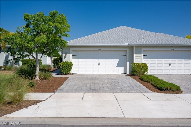 single story home with a garage