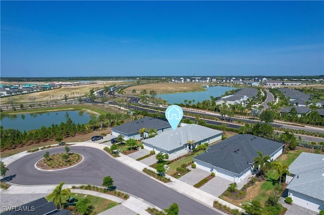 drone / aerial view with a water view