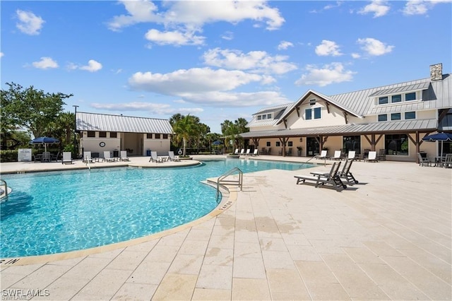 view of swimming pool with a patio