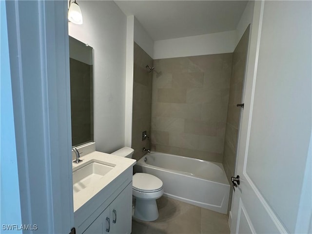 full bathroom featuring tile patterned floors, vanity, tiled shower / bath combo, and toilet