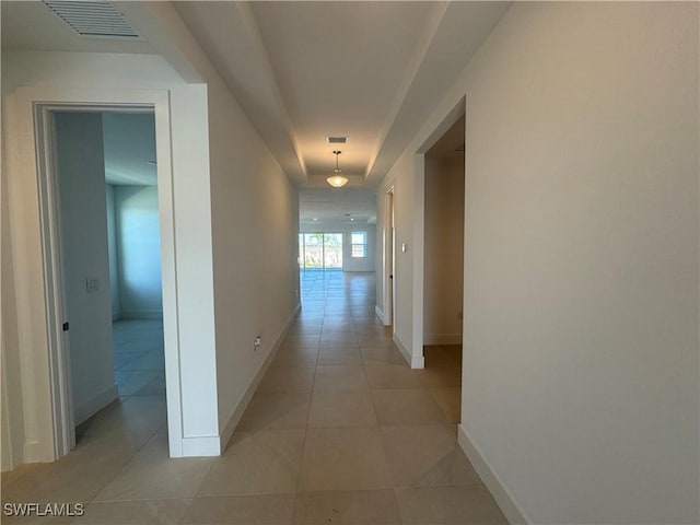 hallway featuring light tile patterned floors