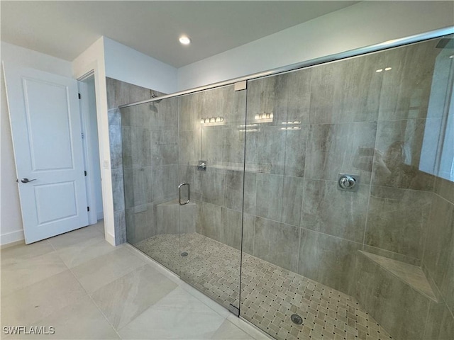 bathroom featuring tile patterned flooring and walk in shower