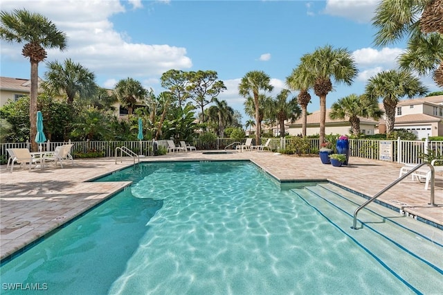 view of swimming pool with a patio area