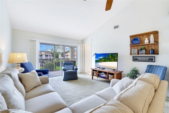 carpeted living room featuring high vaulted ceiling and ceiling fan