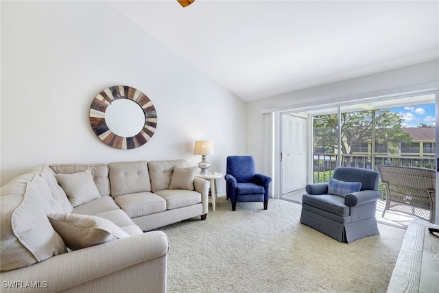 carpeted living room with vaulted ceiling