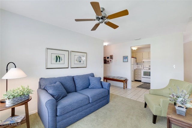 tiled living room featuring ceiling fan