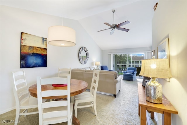 dining area featuring carpet, high vaulted ceiling, and ceiling fan