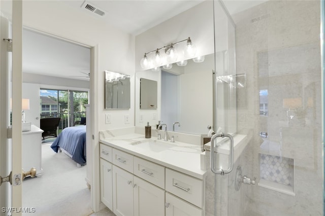 bathroom with ceiling fan, walk in shower, and vanity