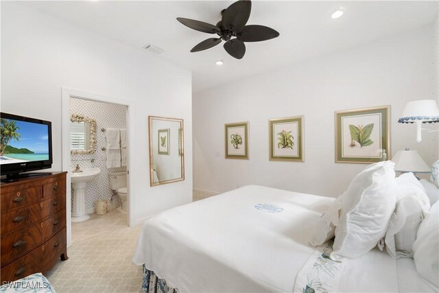 bedroom with ceiling fan and ensuite bathroom