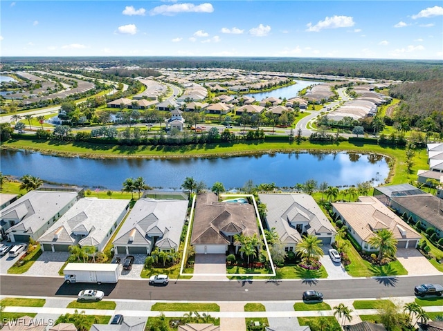 drone / aerial view with a water view