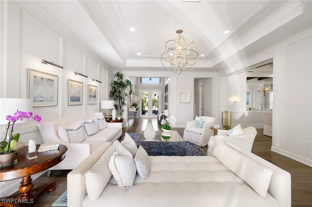 living room featuring french doors, an inviting chandelier, a raised ceiling, dark hardwood / wood-style flooring, and crown molding