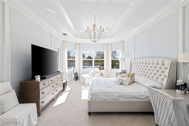 bedroom featuring a notable chandelier, ornamental molding, light carpet, and a tray ceiling