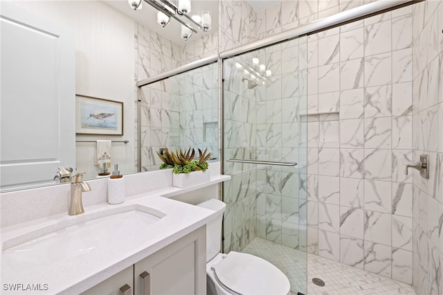 bathroom featuring vanity, toilet, and walk in shower