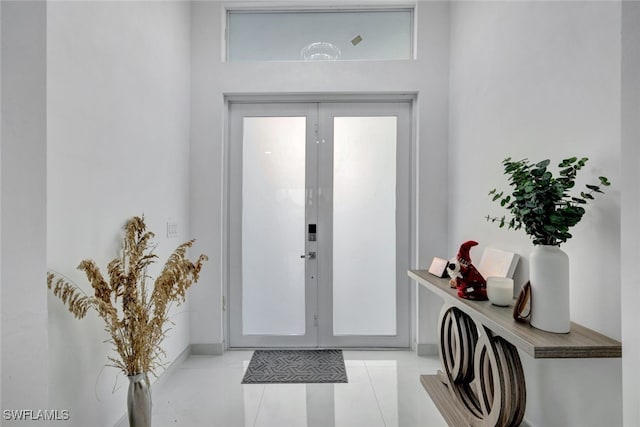 tiled entryway with french doors