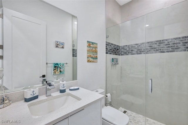 bathroom with toilet, an enclosed shower, and vanity