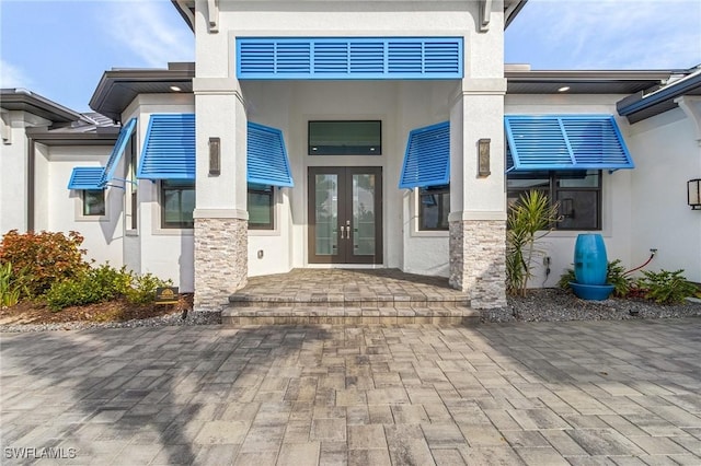 entrance to property featuring french doors