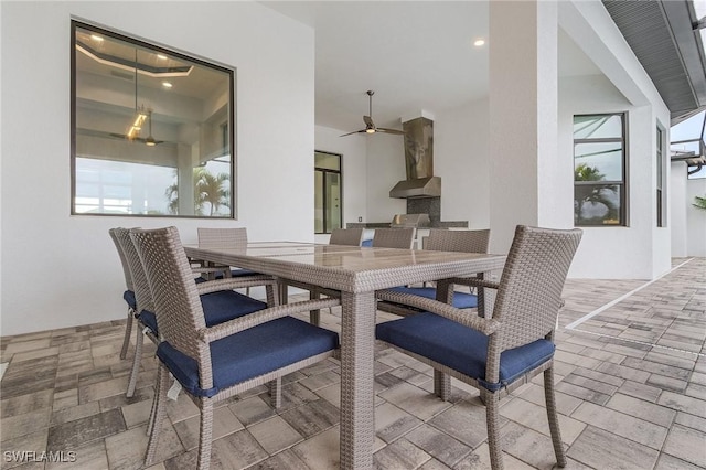 dining room featuring ceiling fan and a wealth of natural light