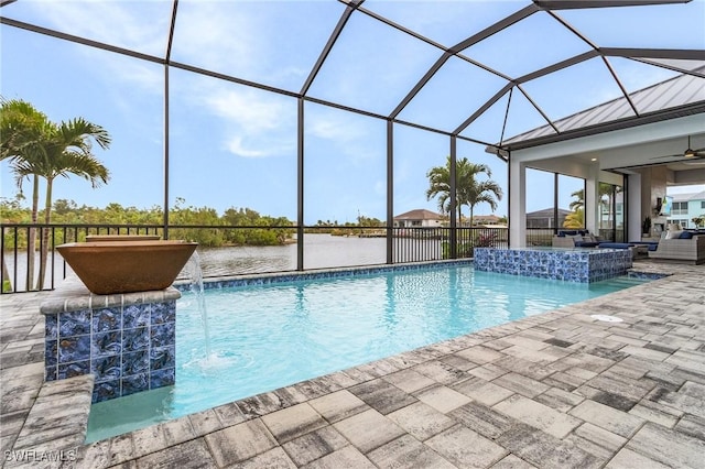 view of pool featuring pool water feature, a lanai, and a water view