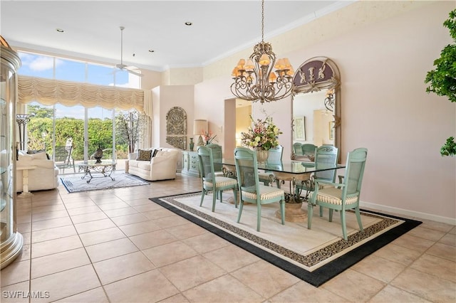 tiled dining area with ceiling fan with notable chandelier, a towering ceiling, and crown molding