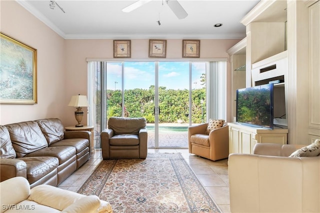 tiled living room with a wealth of natural light, ceiling fan, and crown molding