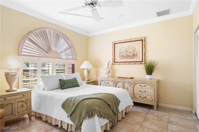 tiled bedroom with ceiling fan and crown molding