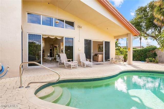 view of swimming pool with a patio