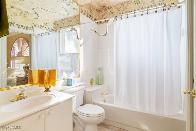 full bathroom with shower / bath combo, vanity, and toilet