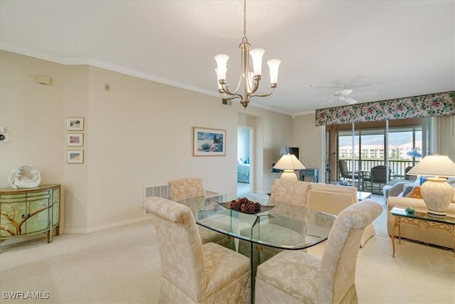 dining area with light colored carpet, ceiling fan with notable chandelier, and ornamental molding