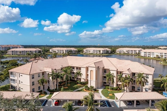 birds eye view of property with a water view