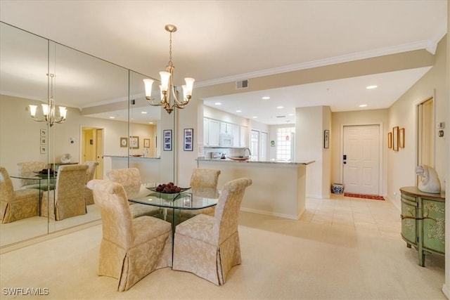 carpeted dining area with an inviting chandelier and ornamental molding