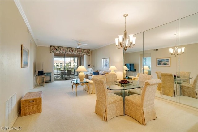 dining room featuring light carpet, ceiling fan with notable chandelier, and ornamental molding